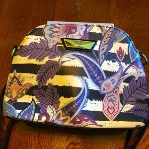 Cute Nicole purse in purples and beige background